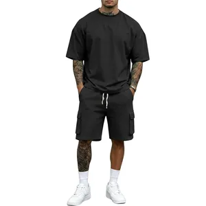 Detail view of men's black oversized T-shirt and matching cargo shorts two-piece set