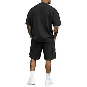 Back view of a men's oversized charcoal grey athletic t-shirt and matching cargo shorts set
