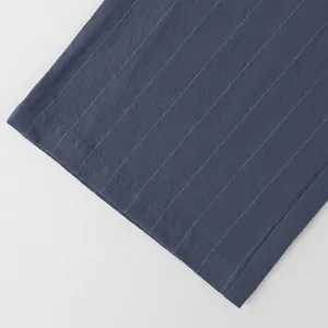 Close-up of breathable striped linen fabric on men's straight-leg casual beach pants