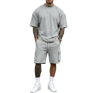 Detail view of a man wearing a grey street style t-shirt and cargo shorts summer set