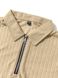 Close-up detail of men's ribbed knit polo shirt showing zipper and collar texture