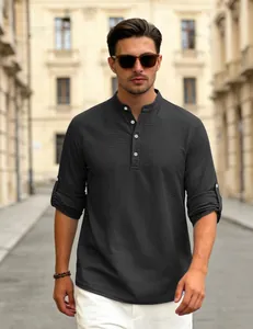 Detailed street style view of a men's black waffle knit Henley shirt with roll-up sleeves.