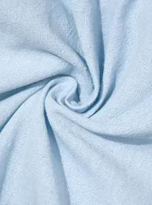 Macro detail of light blue breathable linen fabric showing high-quality woven texture