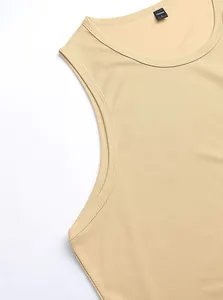 Detail shot of the breathable mesh fabric and collar on a beige men's sports tank top