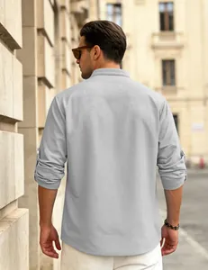 Back view of men's grey waffle knit shirt with roll-up sleeves and casual loose fit.