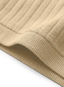 Close-up of beige vertical stripe jacquard knit fabric showing ribbed texture and quality.
