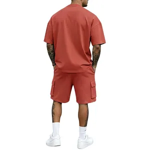 Back view of men's terracotta oversized T-shirt and cargo shorts set in casual sports style
