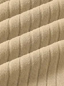 Macro view of the breathable beige vertical stripe jacquard knit fabric texture details