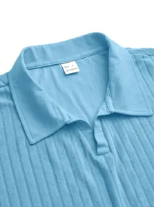 Close-up of light blue ribbed knit polo shirt with collar and size L tag detail.