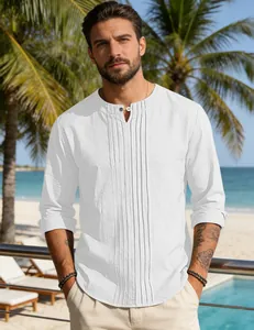 Close-up detail of men's white cotton linen shirt with elegant vertical pleated front.