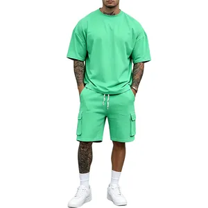 Full front view of a men's mint green oversized t-shirt and cargo shorts outfit set