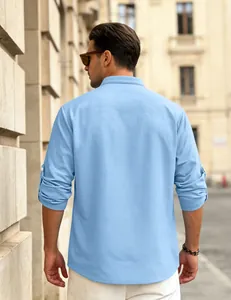 Back view of light blue waffle knit men's long sleeve shirt with roll-up sleeves