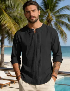 Close-up of a men's black cotton linen long-sleeve shirt with unique pleated chest details.