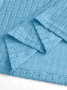 Close-up view of the breathable ribbed knit fabric of a blue men's leisure polo shirt.