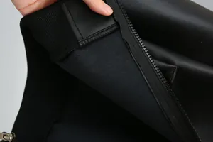 Close-up of black boys PU leather jacket showing collar zipper and inner lining