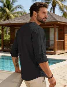 Back view of black cotton-linen long-sleeved shirt in a casual resort poolside setting