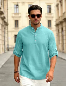 Close-up detail of men's turquoise waffle knit Henley shirt with roll-up long sleeves
