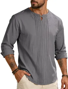 Detail view of a men's grey cotton linen shirt with pleated front and V-neck design