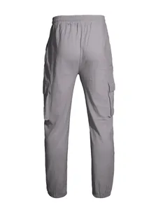 Back view showing rear fit and waist detail of light gray linen cargo jogger pants.