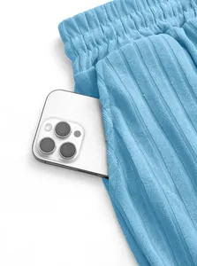 Close-up of side pocket on men's blue ribbed knit shorts with phone storage space