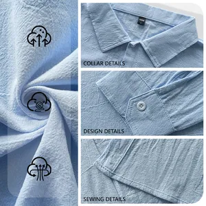 Close-up of the breathable light blue linen fabric and stitching on a men's shirt.