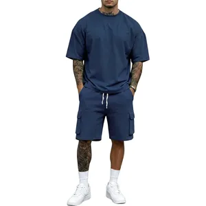 Detailed view of men's navy blue loose-fit cotton t-shirt and cargo shorts summer outfit set