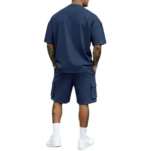 Back view of men's navy blue oversized t-shirt and cargo shorts two-piece summer set