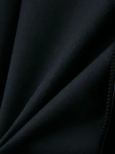 Close-up macro view of high-quality black fabric texture and zipper on boys jacket