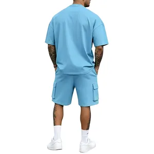 Back view of a men's light blue oversized T-shirt and cargo shorts sports set