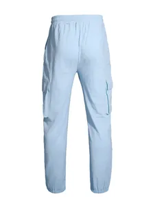 Back view of light blue men's linen cargo pants with elastic jogger cuffs and pockets