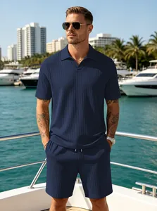Detailed view of the men's navy blue ribbed knit polo shirt and shorts summer set on a yacht