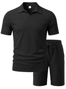 Detailed close-up of men's black ribbed knitted Polo shirt and shorts leisure set