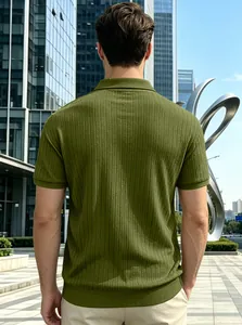 Back view of men's green vertical stripe jacquard knitted Polo shirt in outdoor urban setting