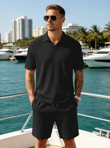 Detailed lifestyle shot of men's black ribbed knit Polo set on a luxury yacht deck