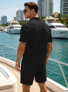 Detailed back view of men's summer black ribbed knit polo shirt and matching shorts set
