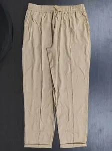 Detail view of men's khaki casual pants with drawstring elastic waist and straight leg