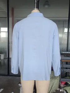 Detailed back view of a men's light blue long-sleeved breathable linen button-down shirt