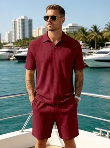 Detail view of men's burgundy ribbed knit polo shirt and shorts set on a model