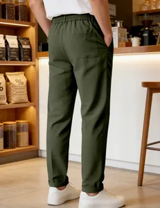 Detail view of men's olive green casual pants with back pocket in a cafe setting