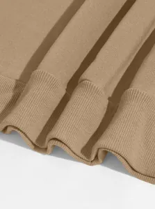 Detail close-up of khaki sweatshirt showing high-quality ribbed cuffs and fabric texture
