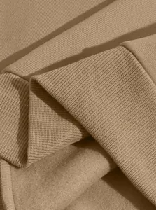 Close-up of khaki men's sweatshirt showing ribbed cuff and warm fleece lining texture