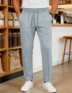 Detail of light blue men's leisure trousers with drawstring waist and elastic band.