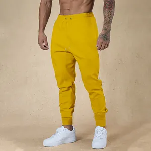 Pantaloni sportivi da uomo giallo brillante slim fit, alta elasticità con coulisse in vita
