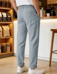 Men's casual light blue straight-leg trousers styled in a relaxed lifestyle setting