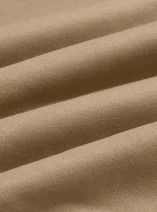 Macro view showing the soft texture of brown knit fabric for men's thermal sweatshirt