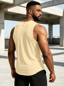 Back view of men's cream sleeveless quick-dry gym tank top in a modern outdoor setting