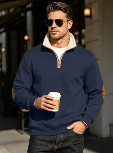 Model wearing mens vintage navy half-zip sweatshirt with brown elbow patches