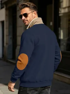 Back view of navy blue sweatshirt featuring retro elbow patches and a stand collar.