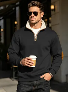 Detailed lifestyle shot of men's black half-zip sweatshirt with warm fleece stand collar.