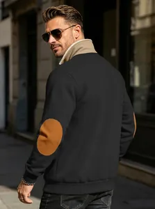 Detail of retro men's black sweatshirt featuring brown elbow patches and stand collar